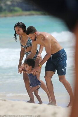 Steph Curry shows off chiseled torso while on Hawaiian beach after his team the Golden State Warriors become NBA Finals champs